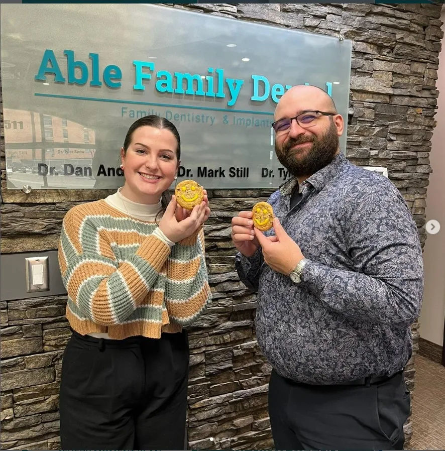 Able Family Dental team with smile cookies