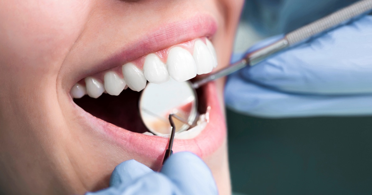 Person brushing their teeth as part of a daily preventive dental care routine