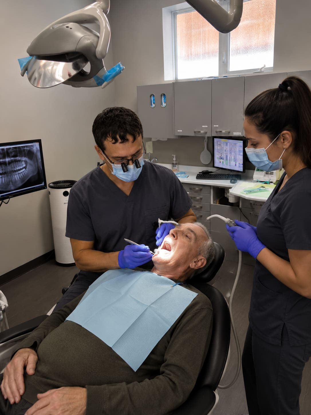 Dentist consulting with a patient at Able Family Dental